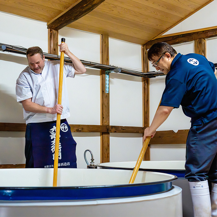 Stuart and Masanobu making sake